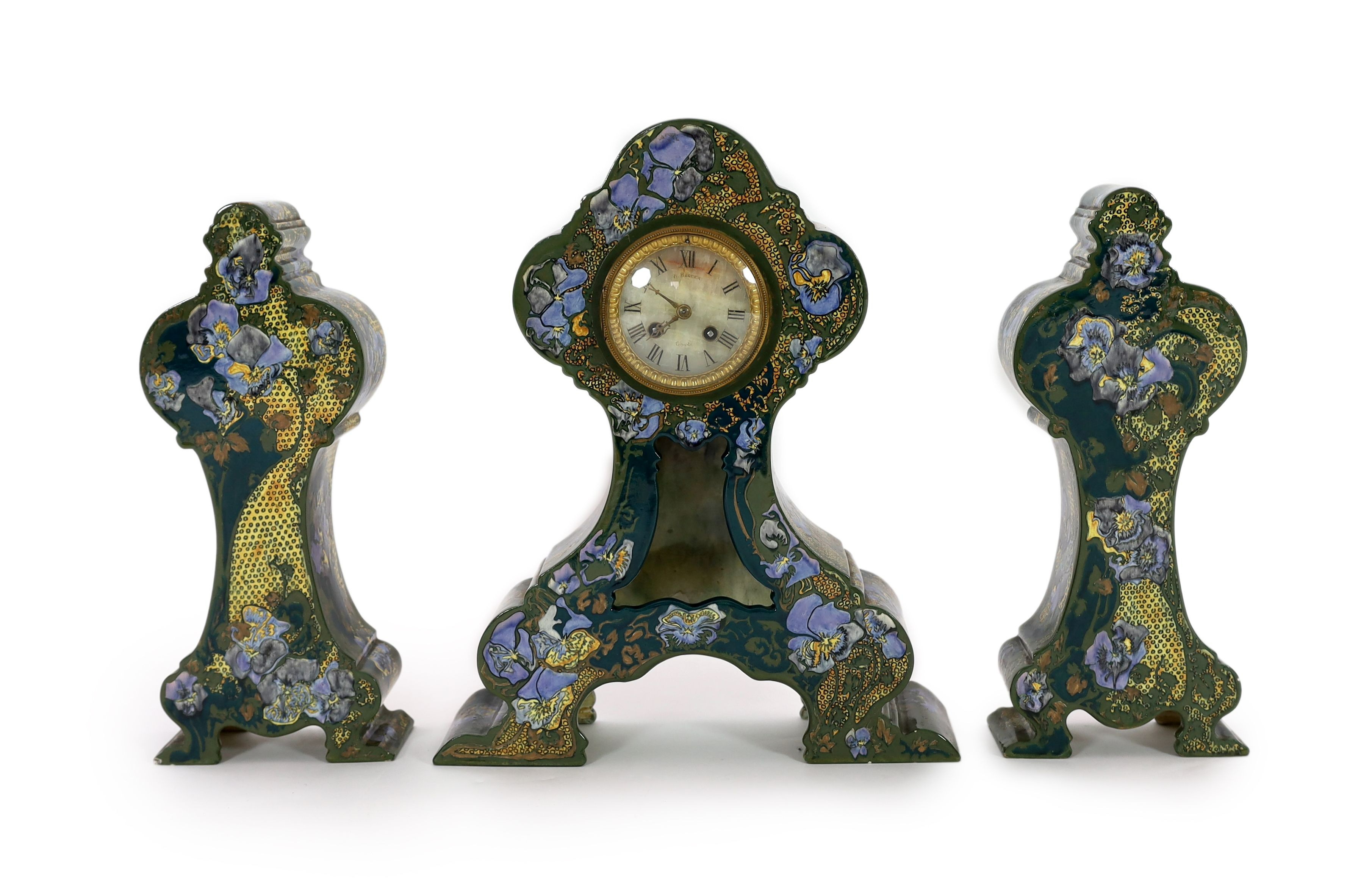 A Rozenberg Art Nouveau earthenware three piece clock garniture, clock 45 cm high